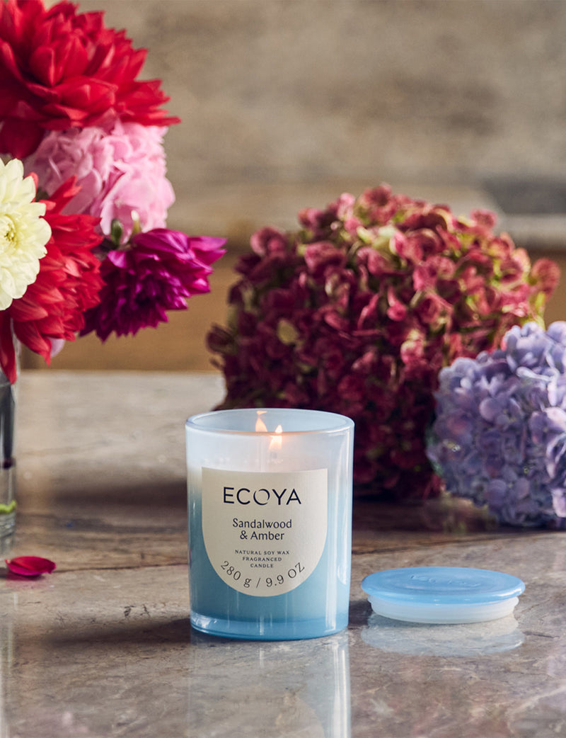 Glass jar candle with sandalwood, amber and patchouli fragrance