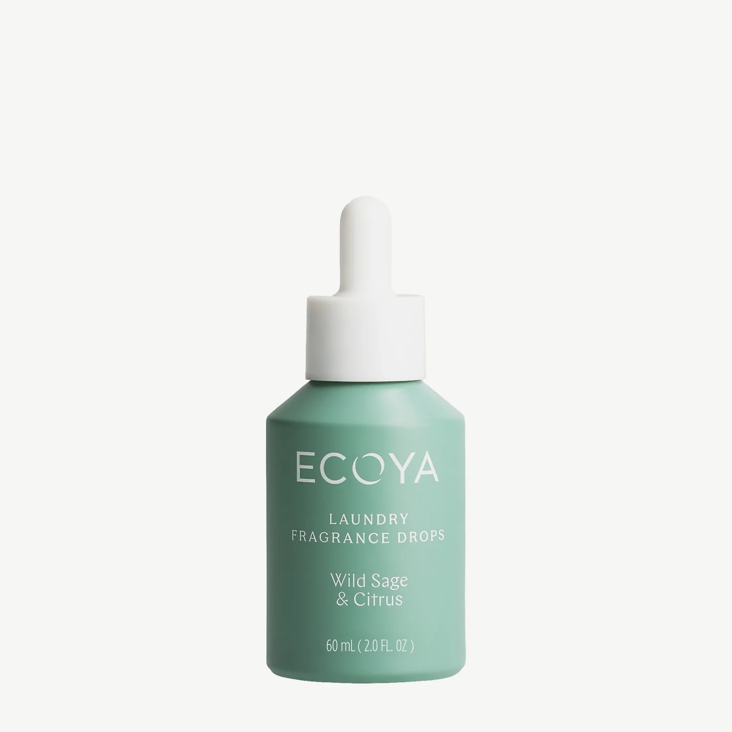 A bottle of ECOYA Wild Sage & Citrus laundry fragrance drops in a mint green color with a white dropper cap, centered on a light off-white background.