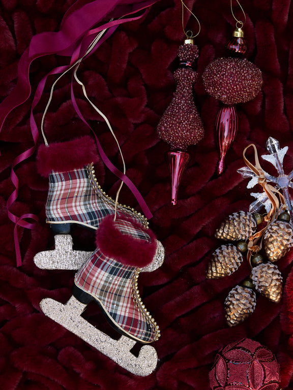 Round beaded burgundy glass Christmas finial – elegant festive hanging ornament. On flatlay with christmas decorations.