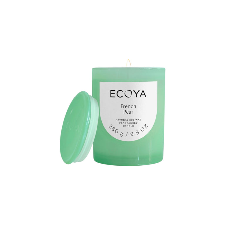 Green Ecoya candle with a white label on a white background