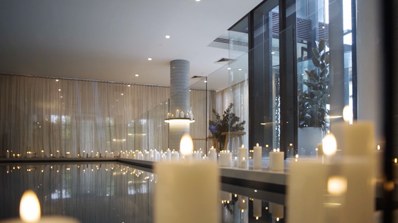 flameless candles styled around an indoor pool