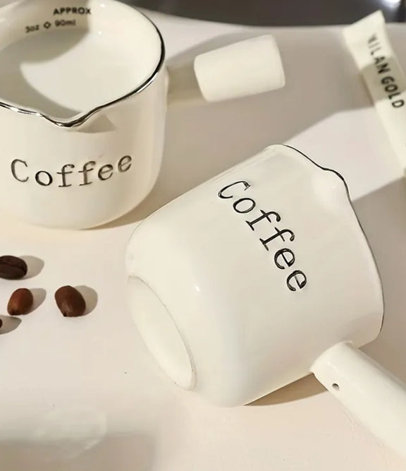 Ceramic coffee measuring cup with graduated markings