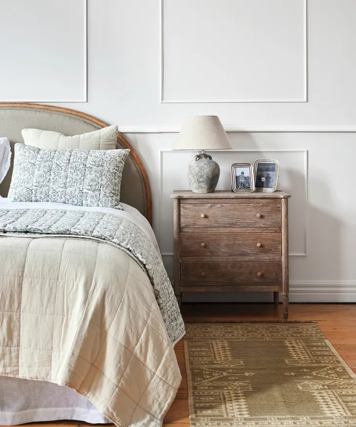 Blue floral handblock pillowcases styled on bed with Athena coverlet