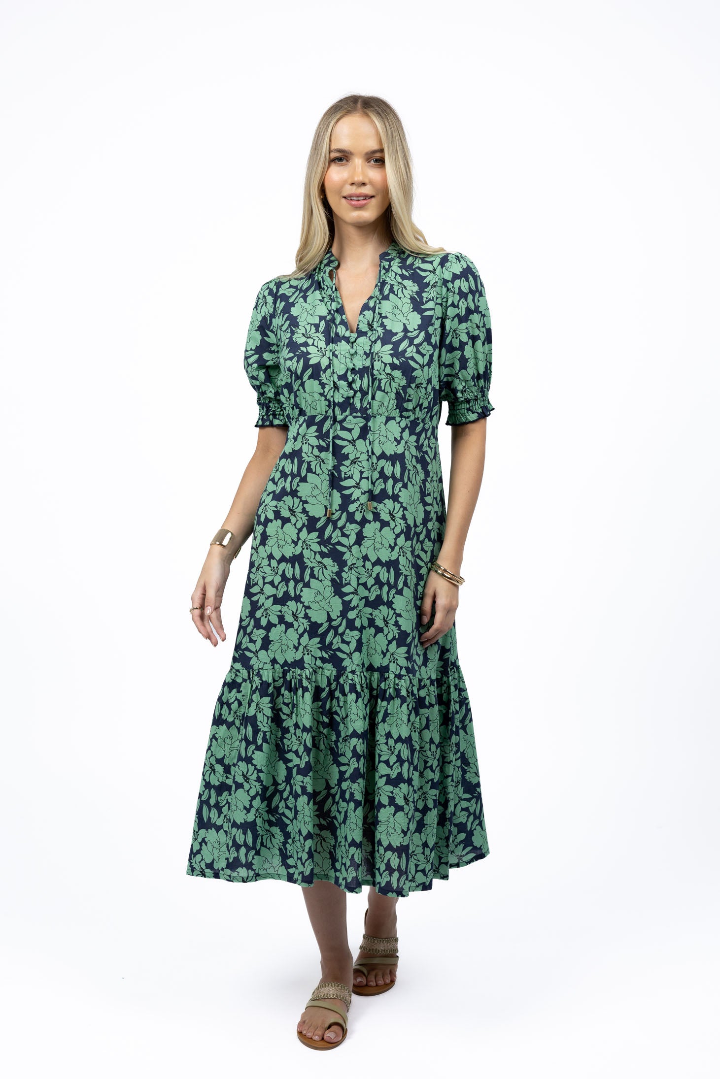 Woman wearing Humidity Fleur Midi Dress in exclusive floral print, front view.