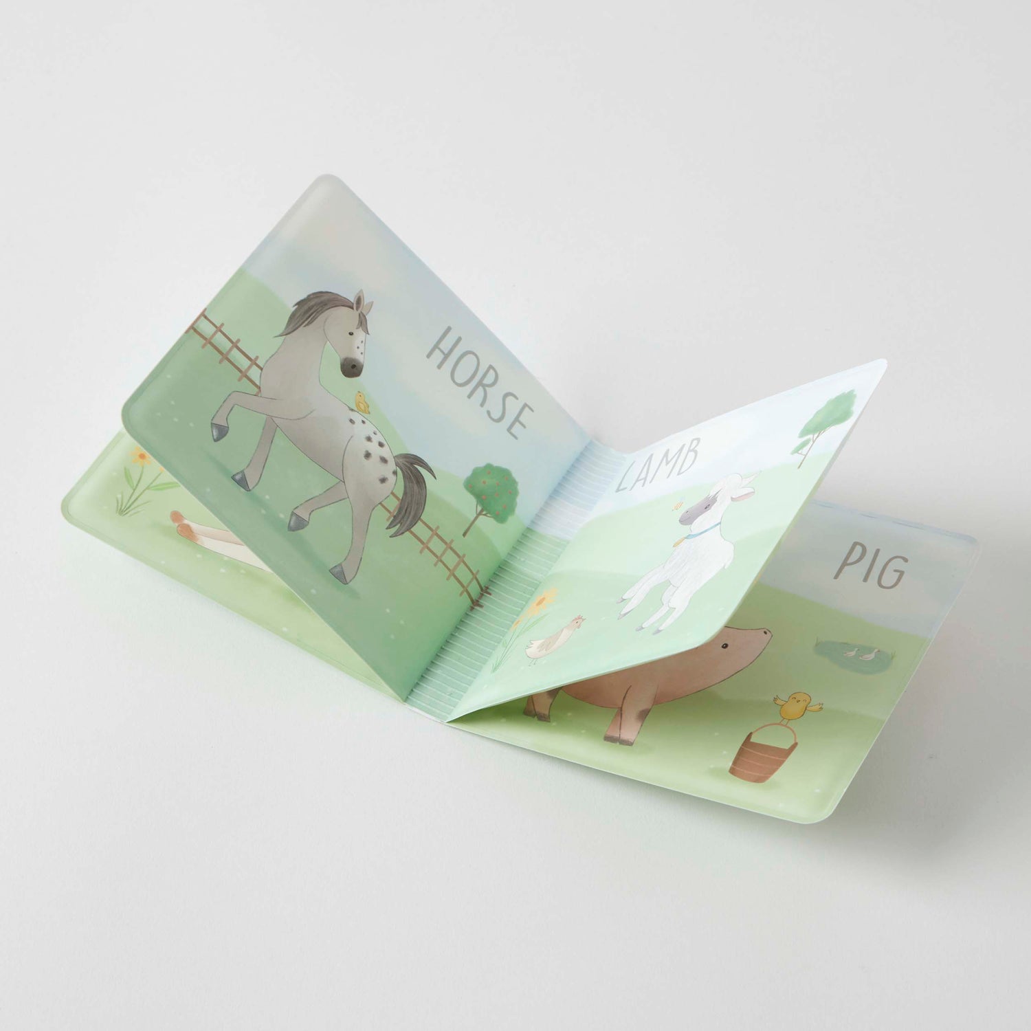 Inside pages of the Farm Fun Bath Book showing waterproof educational imagery