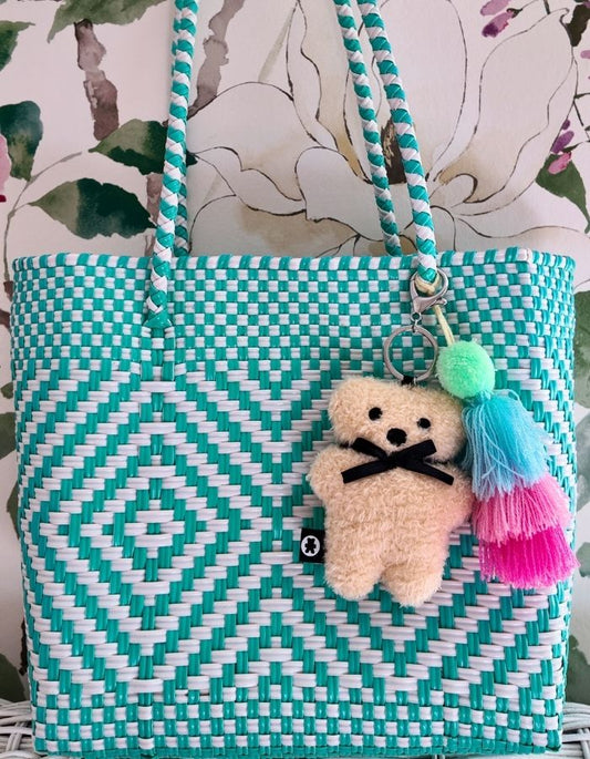 Milk FLATOUTbear furry bag charm measuring 10cm tall.