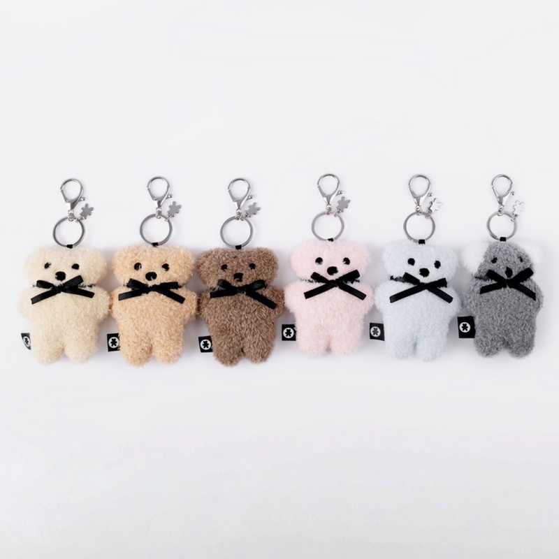 FLATOUTbear Milk Bag Charm with logo charm and metal hardware.