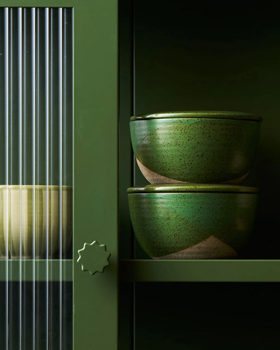 Green stoneware food storage containers for meal prep and leftovers.