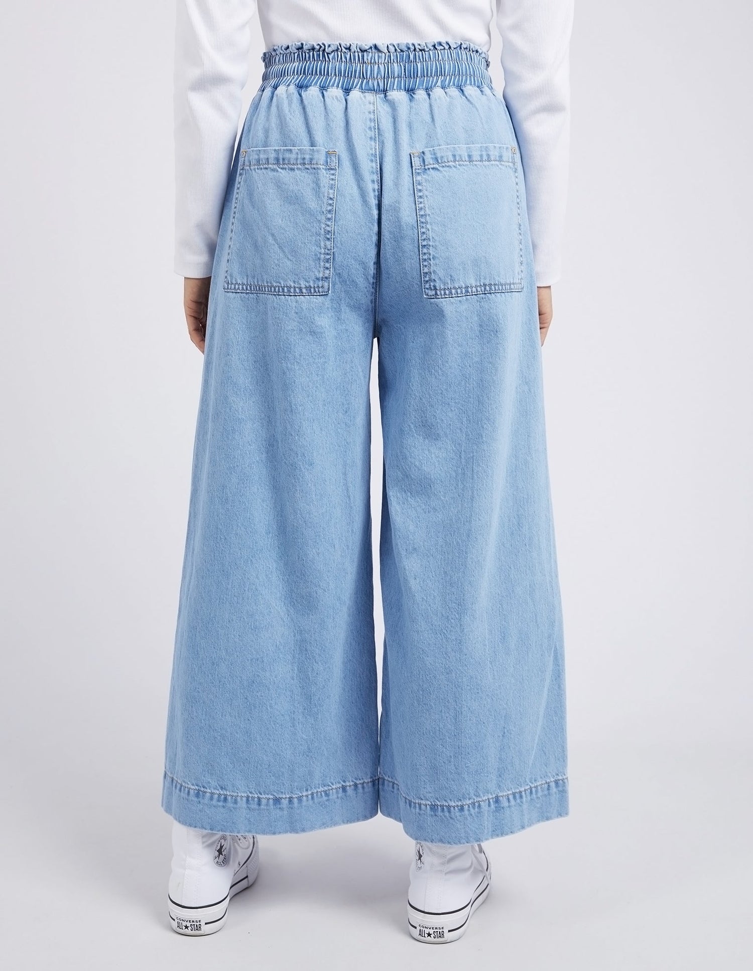 Casual mid blue denim wide leg pants summer style view from back
