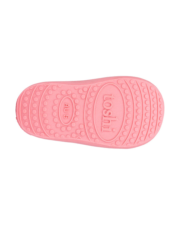 Pink gumboot sole with 'Toshi' branding on a white background - toddler gumboots