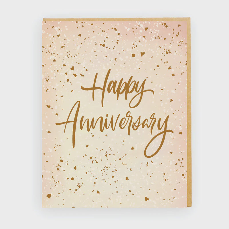 Greeting card with 'Happy Anniversary' text on a beige background with gold speckles