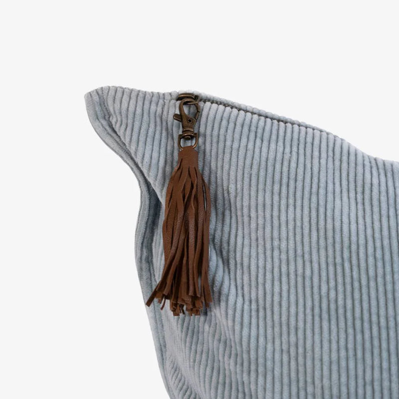 50x50cm blue corduroy cushion with leather tassel detail for living room or bedroom styling.
