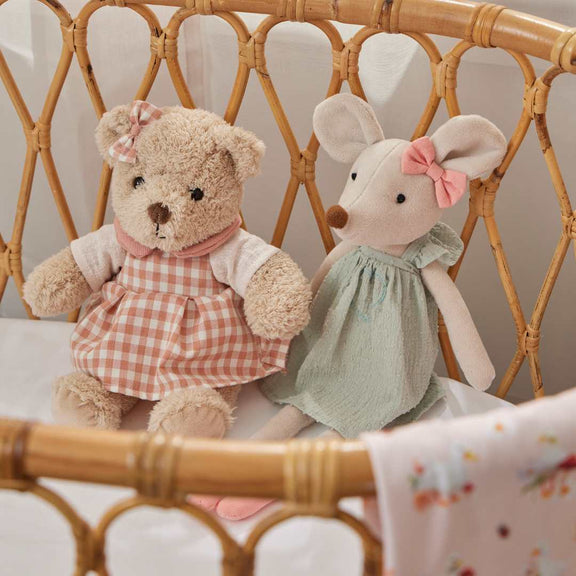 Plush teddy bear in pink outfit for newborn and baby gifts 