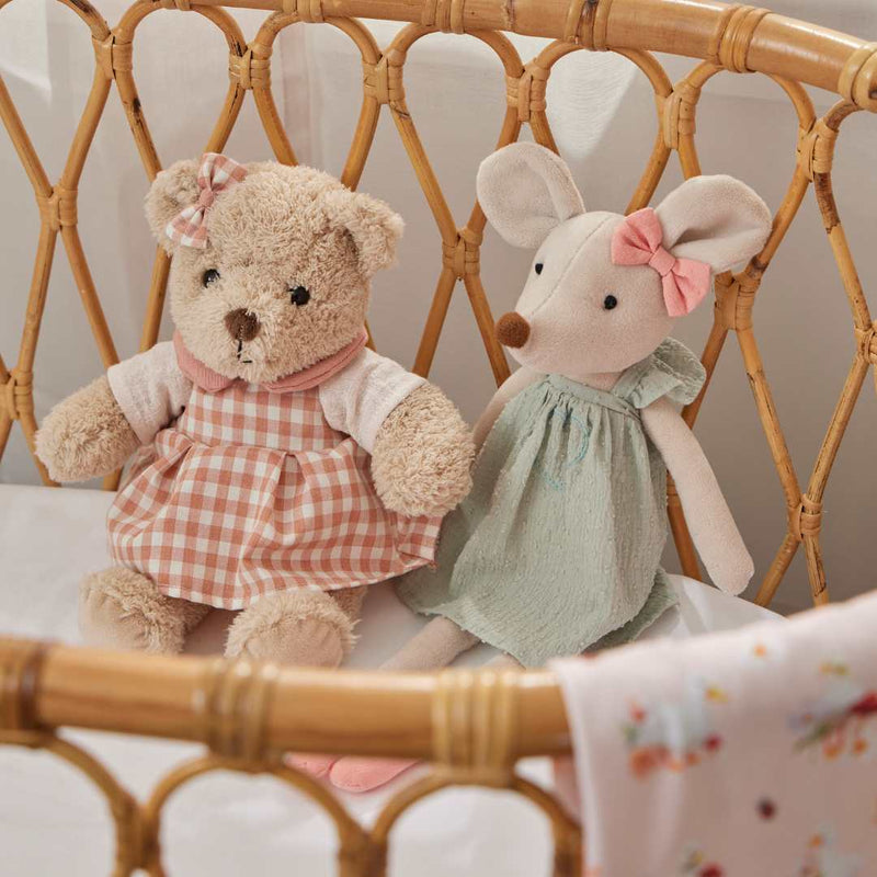 Plush teddy bear in pink outfit for newborn and baby gifts 