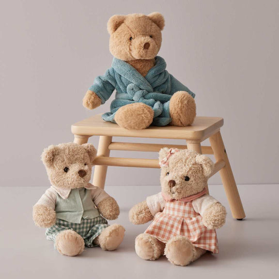 Soft plush teddy bear in green outfit for newborn gift ideas 