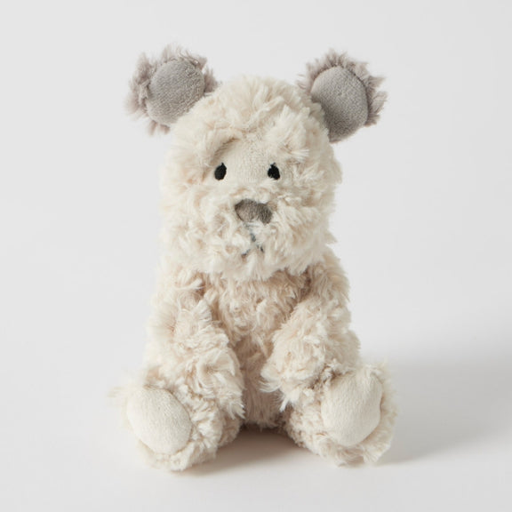 Cream baby dog rattle with soft faux fur and embroidered details 