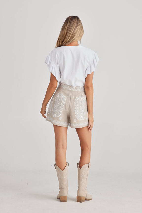 Women’s natural linen shorts with embroidery, side zip and cotton lining, view from behind