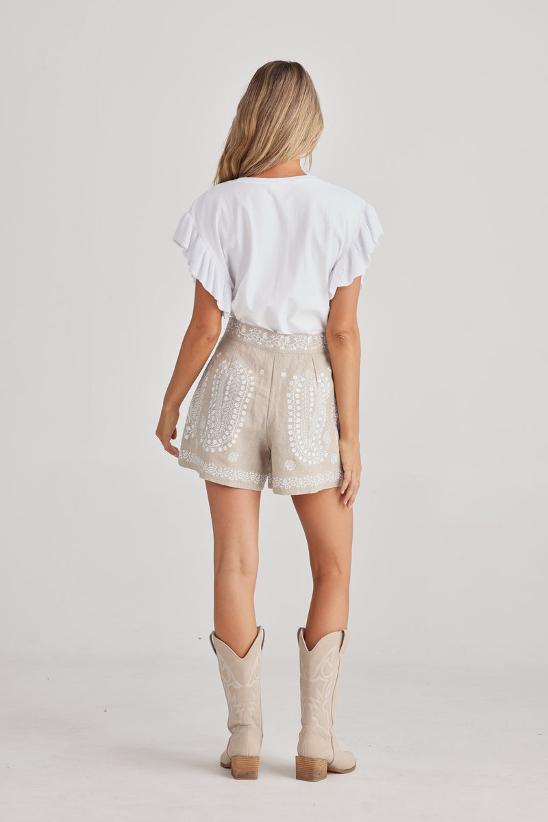 Women’s natural linen shorts with embroidery, side zip and cotton lining, view from behind