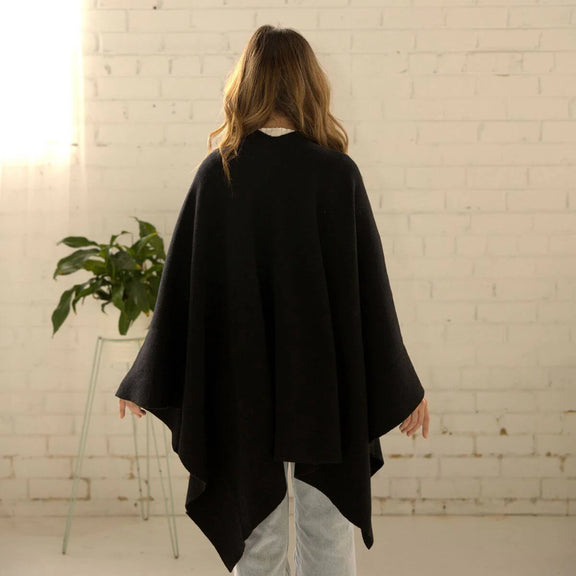 view from behind of women's black wool cape