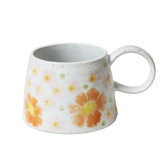 Floral stoneware coffee mug featuring colourful botanical artwork and hand-brushed glaze finish.