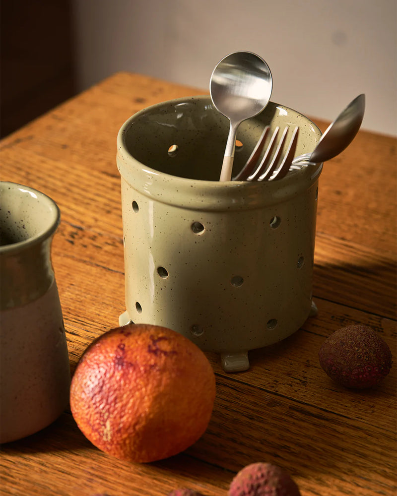 Stoneware colander utensil holder with reactive glaze finish