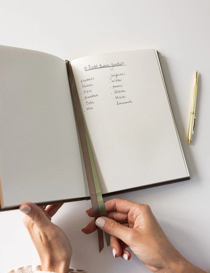 fern green linen journal with bullet pages and satin ribbon markers.