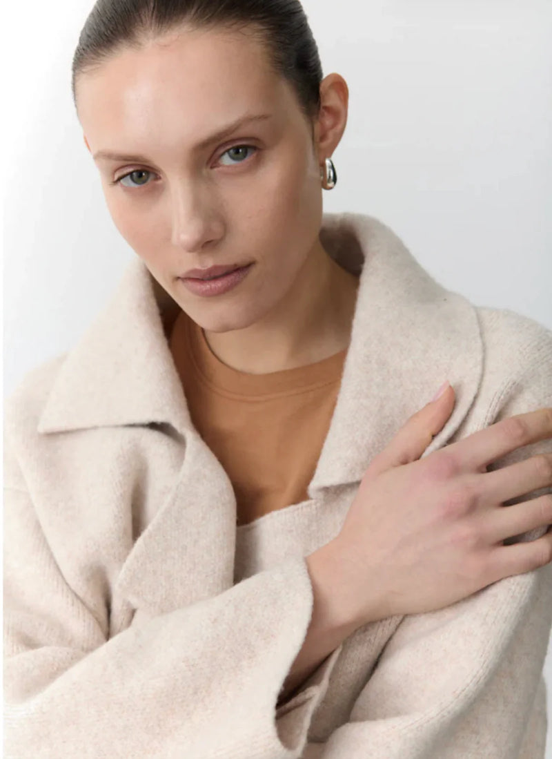 Soft knitted coat and cardigan hybrid in natural beige with cropped sleeves and oversized fit.