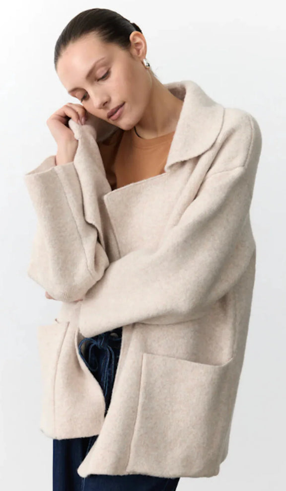 Women's natural knit coatigan featuring an open front, large pockets and relaxed boxy silhouette.