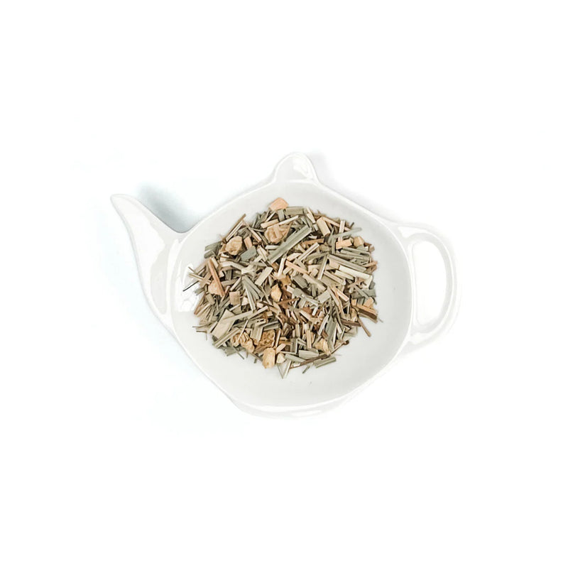 Tea leaves in a white teapot on a white background, Lemongrass & Ginger Loose Leaf Tea - 50g Canister