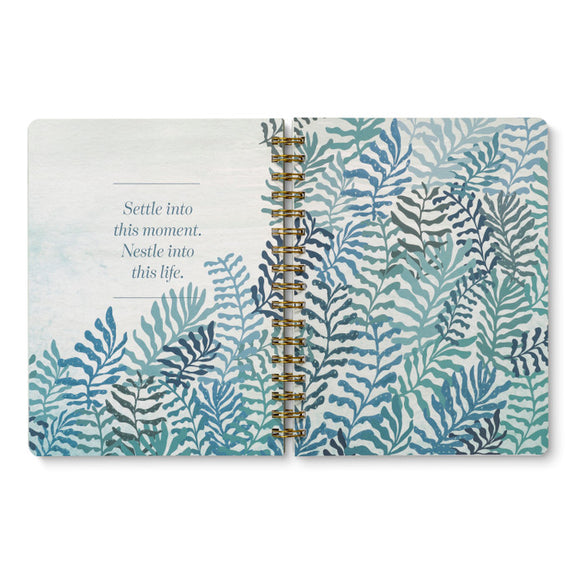 Inspirational spiral-bound notebook with coastal artwork and uplifting breakout spreads throughout.
