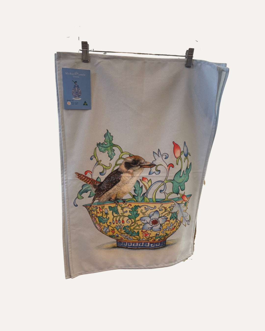 Australian made cotton tea towel featuring a kookaburra perched on a detailed floral bowl.