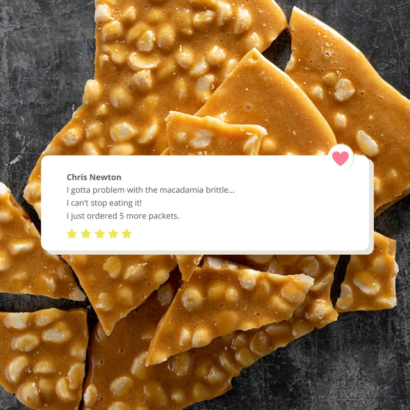 Macadamia brittle with a comment overlay on a dark background