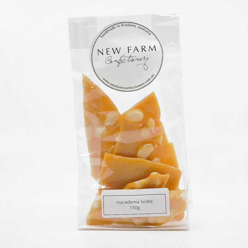 Packaged macadamia brittle from New Farm Confectionery on a white background