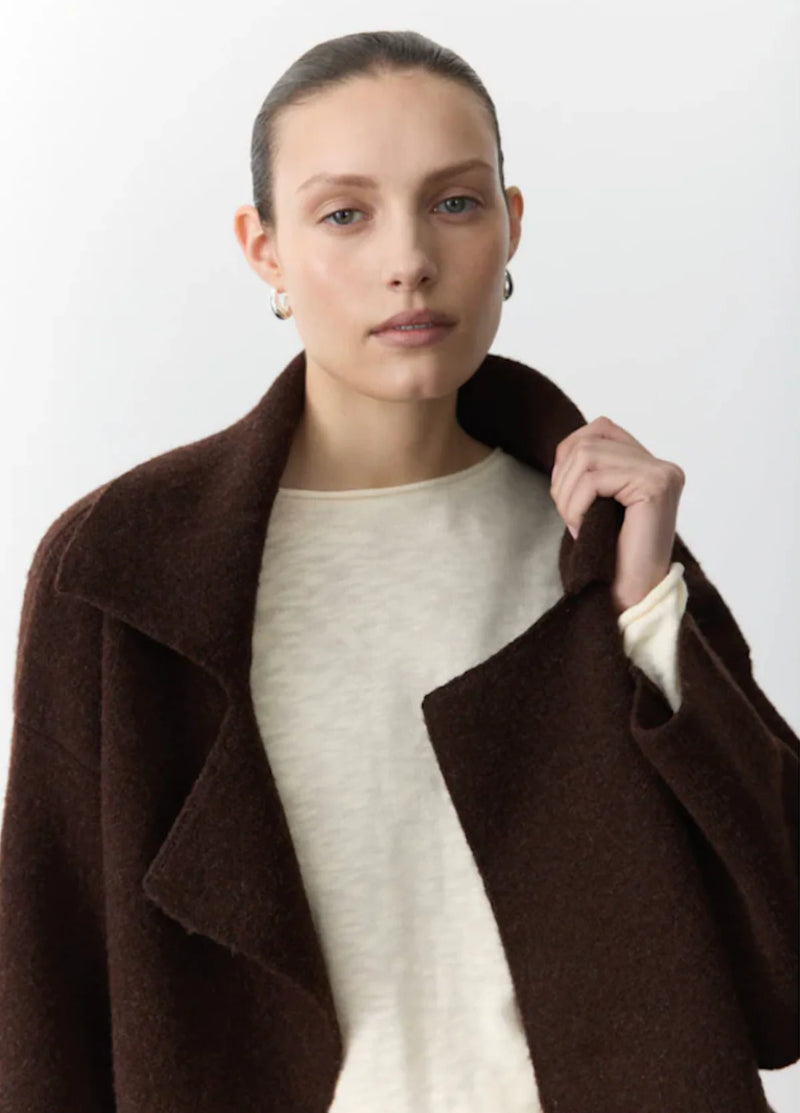 Soft knitted coat and cardigan hybrid in rich brown with boxy fit and cropped sleeves.