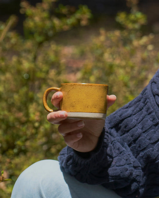 Citrine stoneware coffee mug with reactive glaze finish
