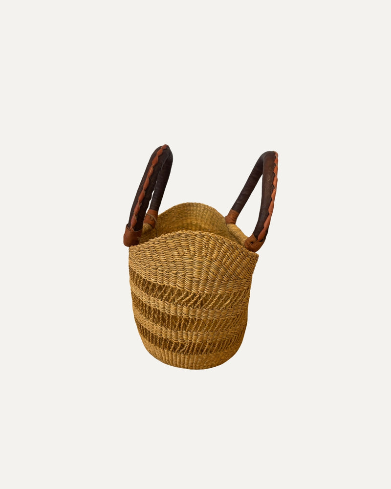 Small natural woven basket for light shopping, home storage or decorative styling.