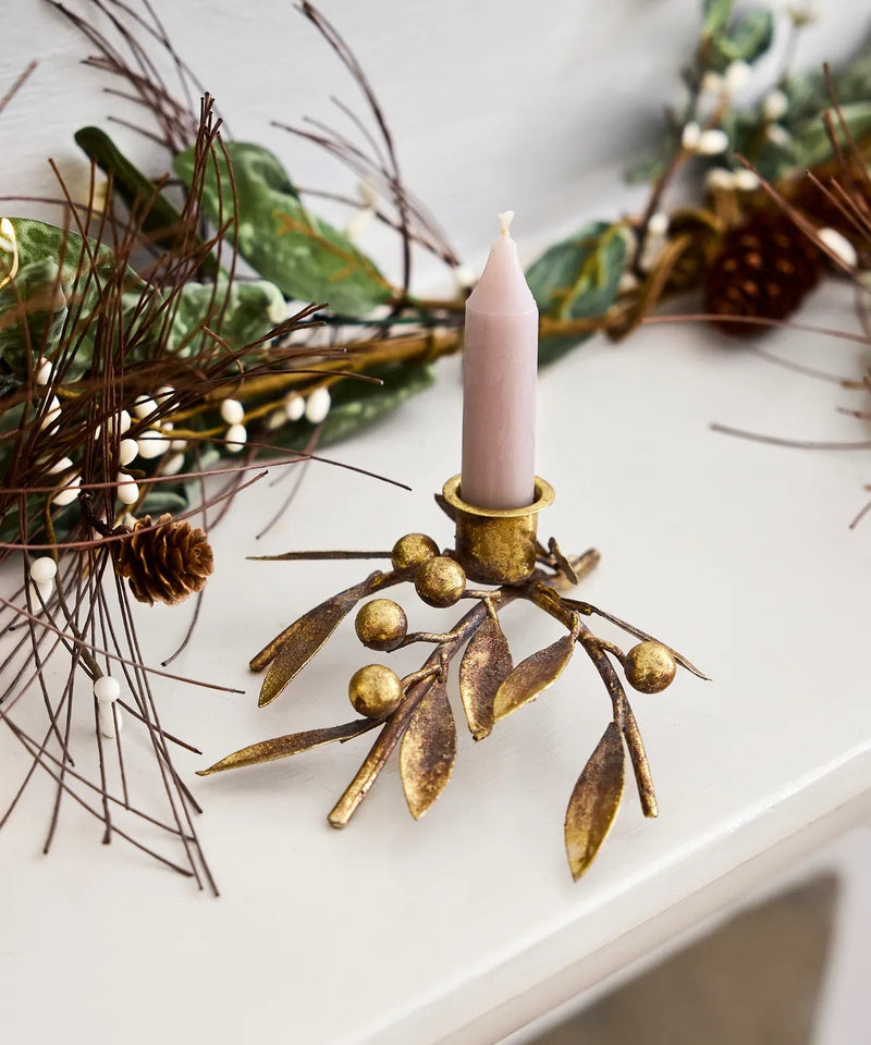 Festive gold candleholder styled on a Christmas dining table