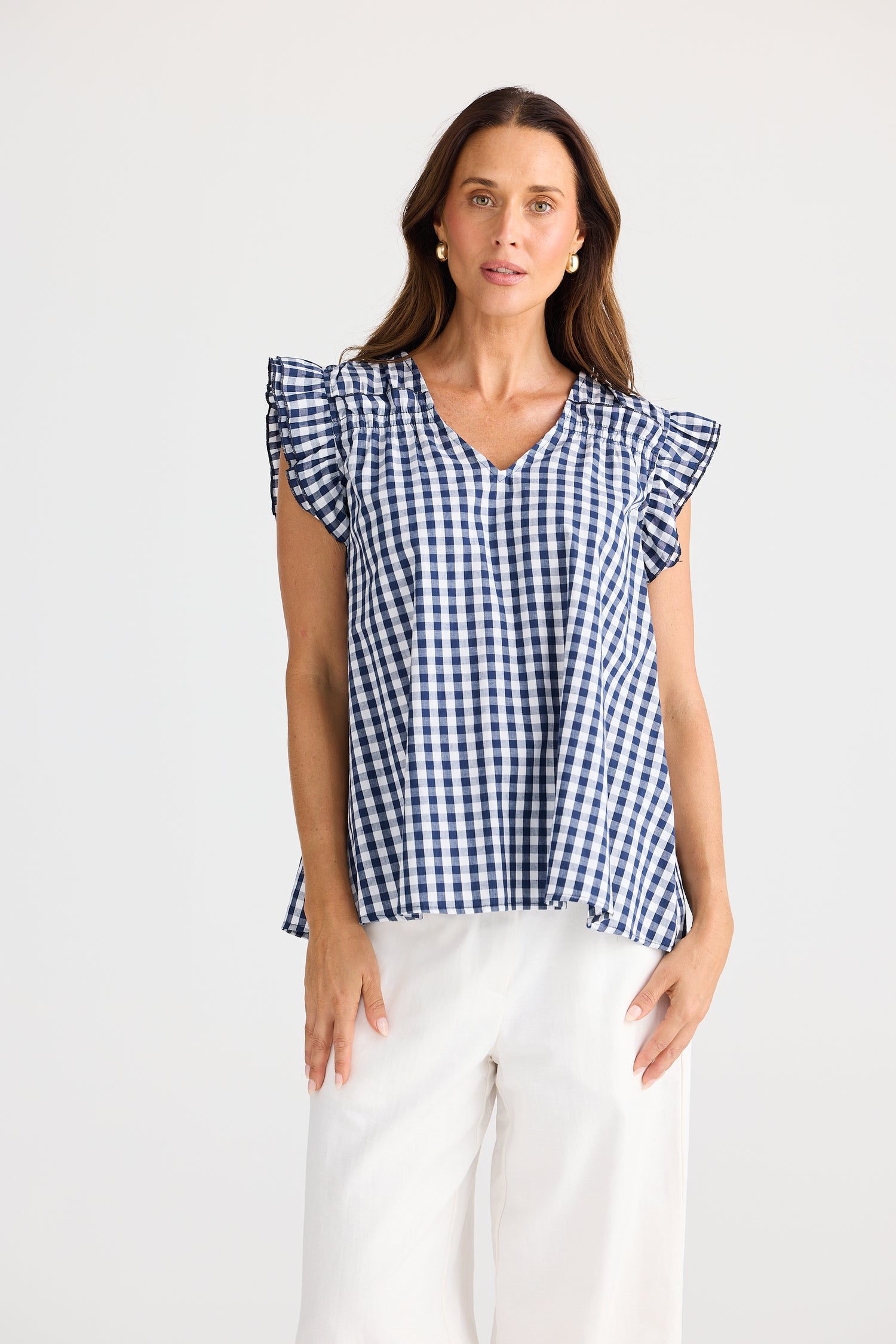 Paz Top Navy Gingham – cotton blouse with V-neck and frill sleeves