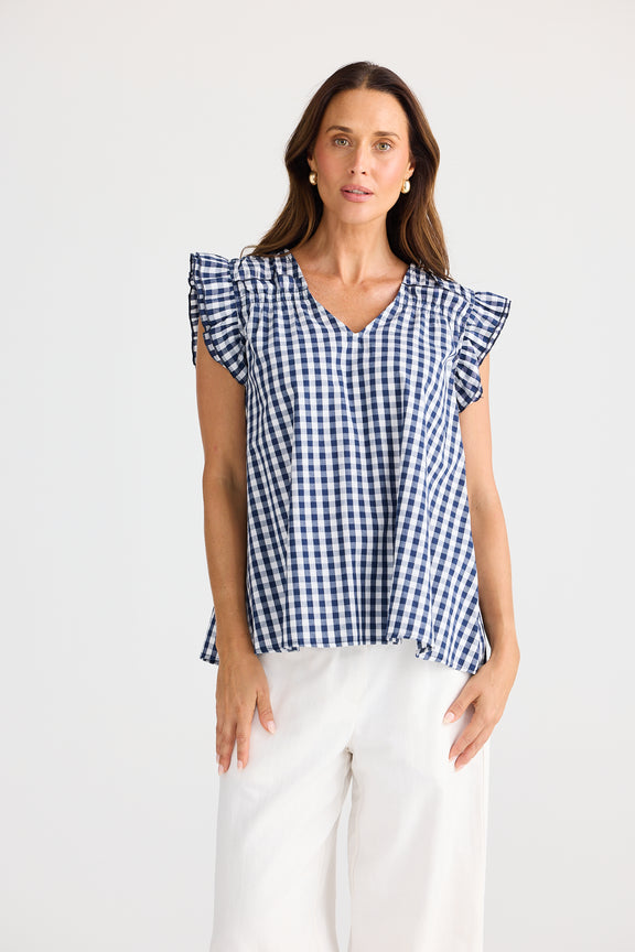 Paz Top Navy Gingham – cotton blouse with V-neck and frill sleeves