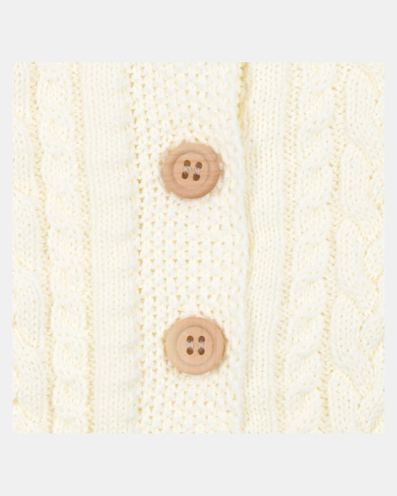 Knitted fabric with two brown buttons on a white background