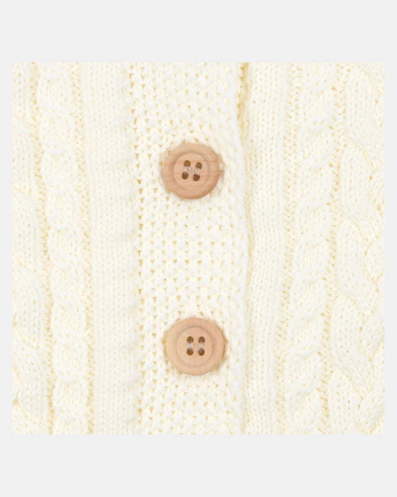 Knitted fabric with two brown buttons on a white background