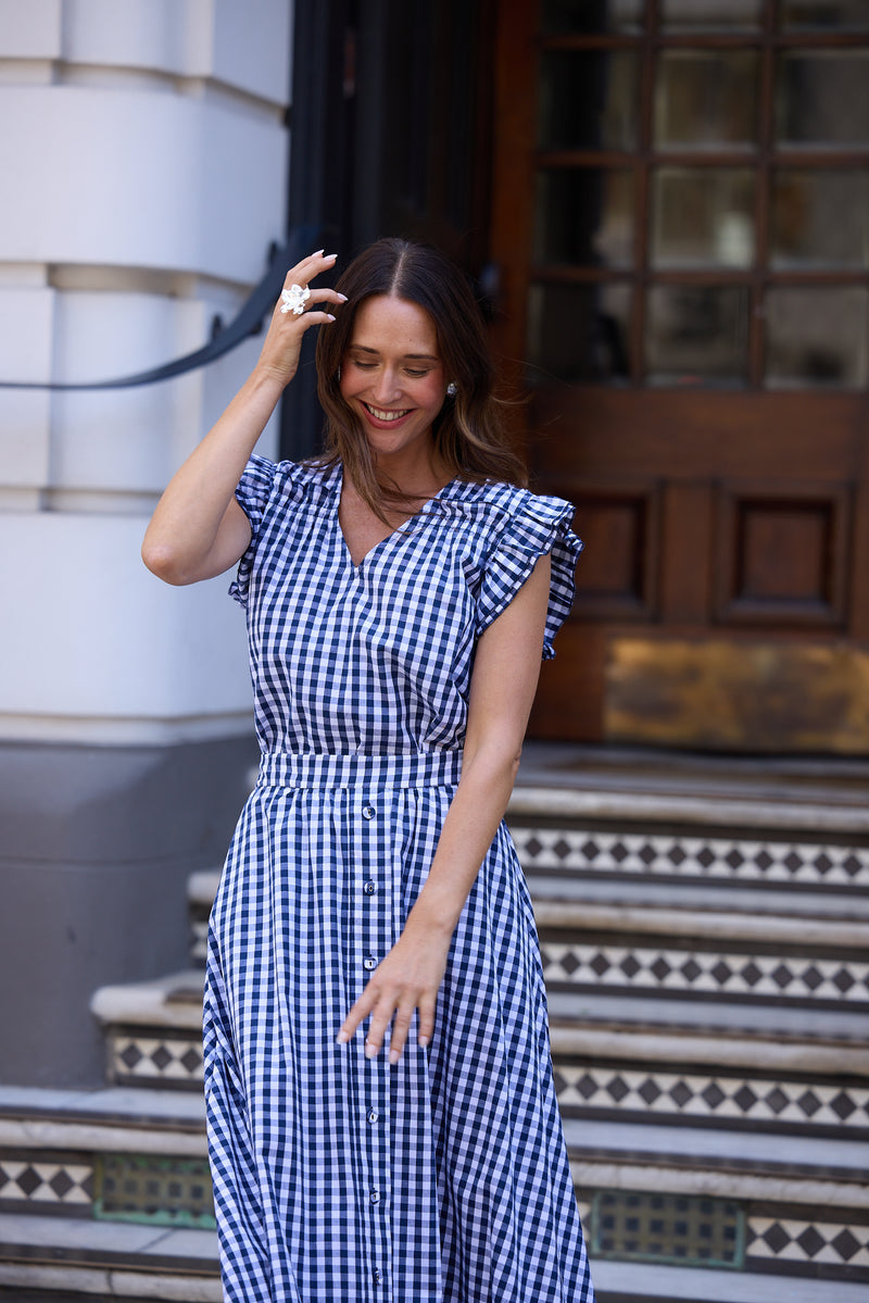 Paz Dress Navy Gingham – 100% cotton V-neck dress with frill sleeves