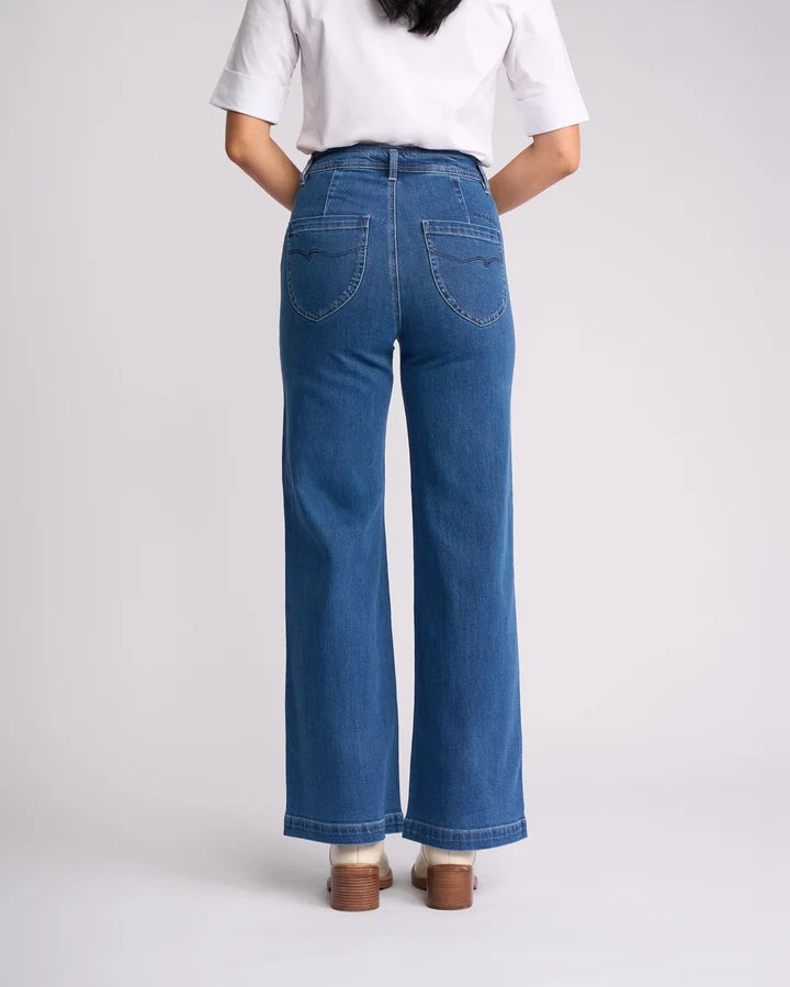 Women's blue wash wide leg jeans with back patch pockets by Vassalli.
