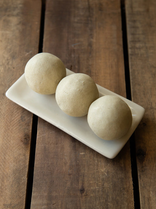 Handmade 120g olive oil soap ball scented with peppermint essential oil.