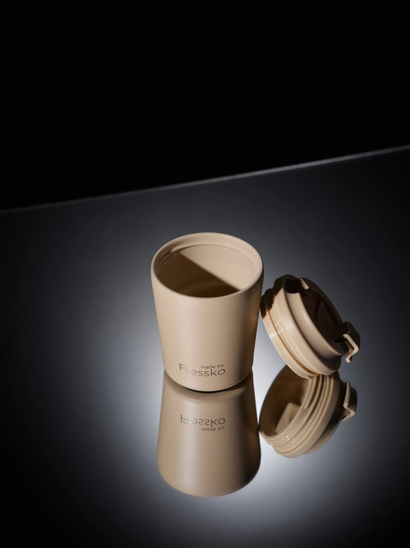 Close up of Piccolo Oat click-back lid and smooth ceramic lining