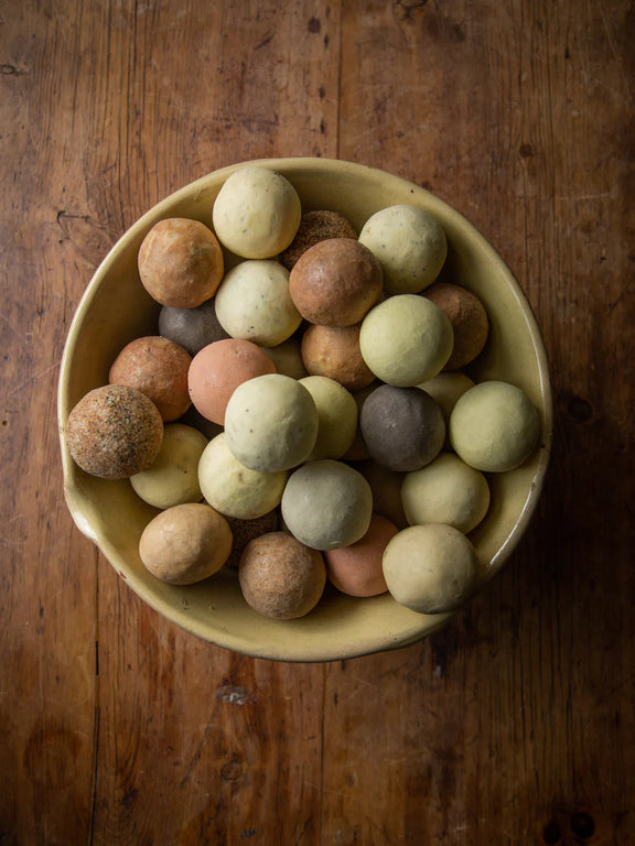 Rustic Pink Clay Geranium soap ball for hand, body and hair cleansing. Image showing collection of Est Soap Balls in a bowl. 