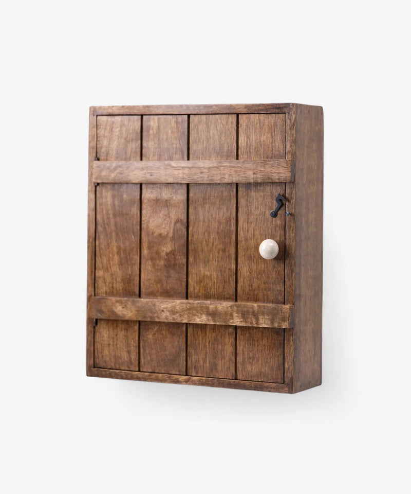 Wooden cabinet with a door and knob on a white background