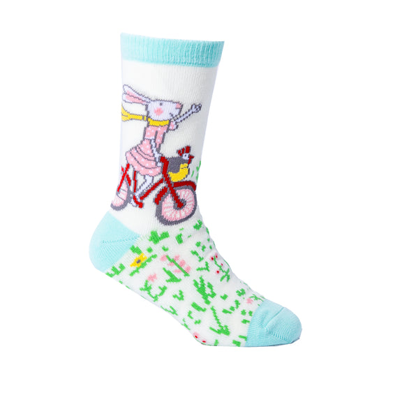 Kids socks featuring Ruby Red Shoes riding a red bike
