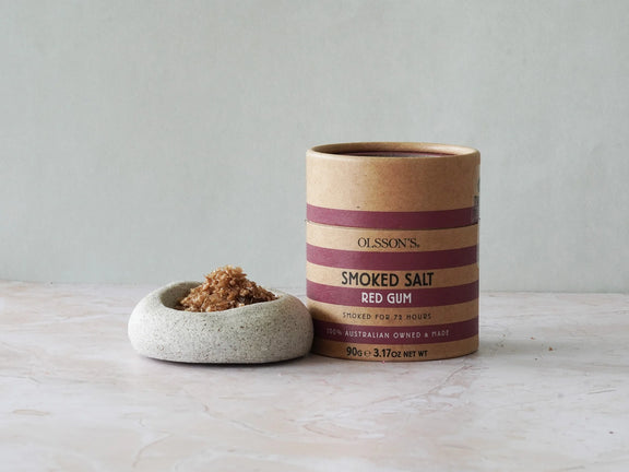 Close up of smoked sea salt flakes showing rich texture