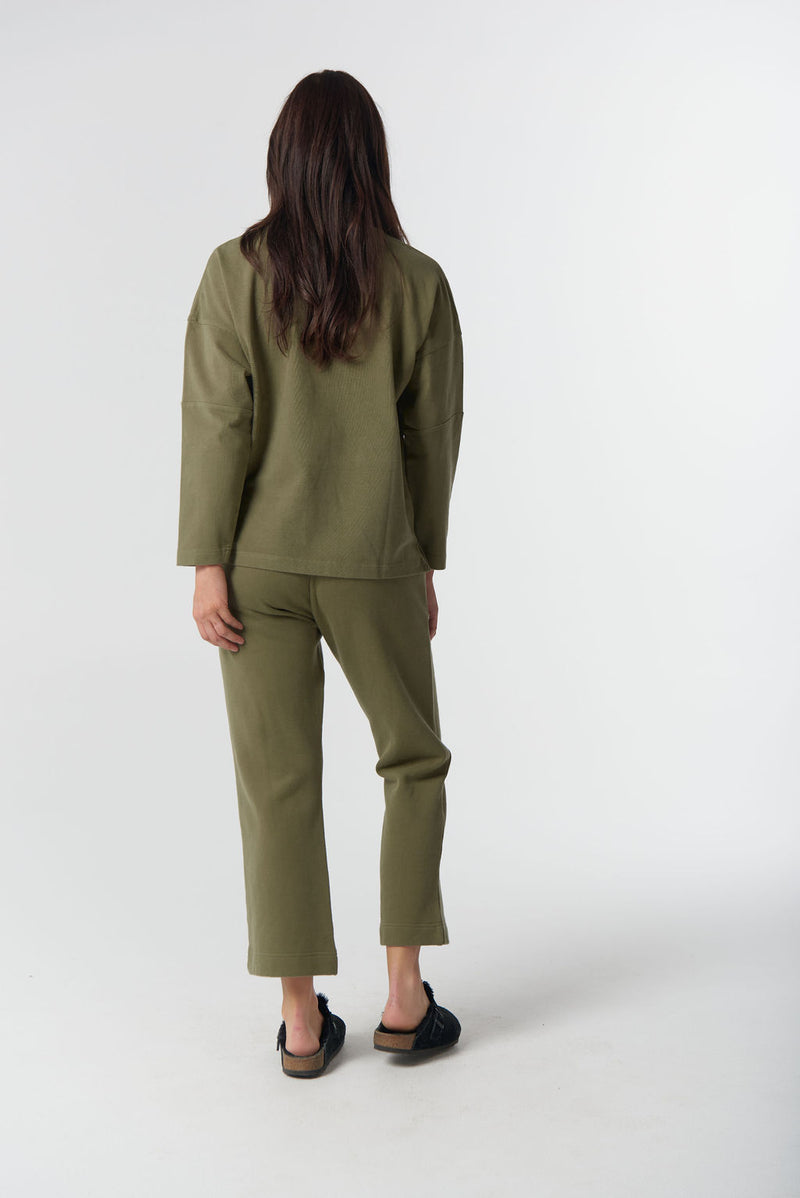 Women's sage green brushed cotton sweater with embroidered GC logo.